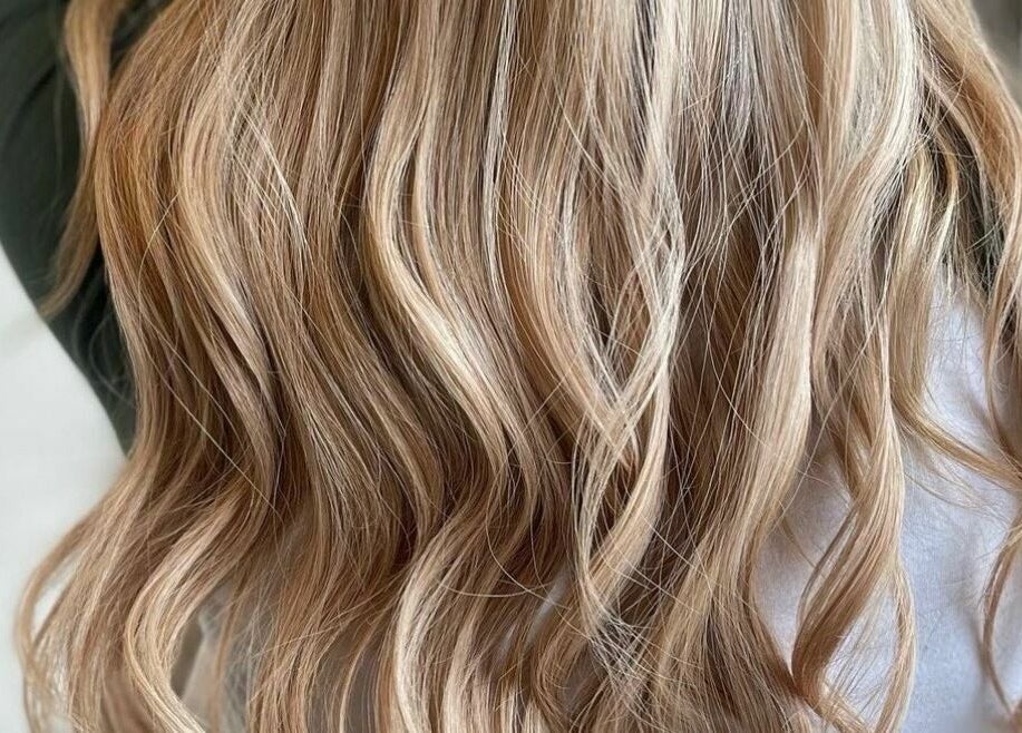 Blonde waves styled at Botega Salon and Gallery in Banff, Alberta, CA, showcasing exquisite hair artistry.
