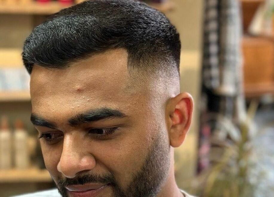 Man with trendy fade hairstyle at Botega Salon and Gallery, Banff, Alberta, CA.