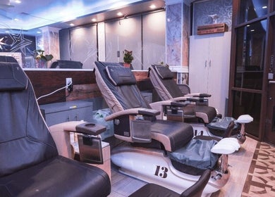 Comfortable pedicure chairs in Star Nails Bar, Vista, California, US, with modern decor.