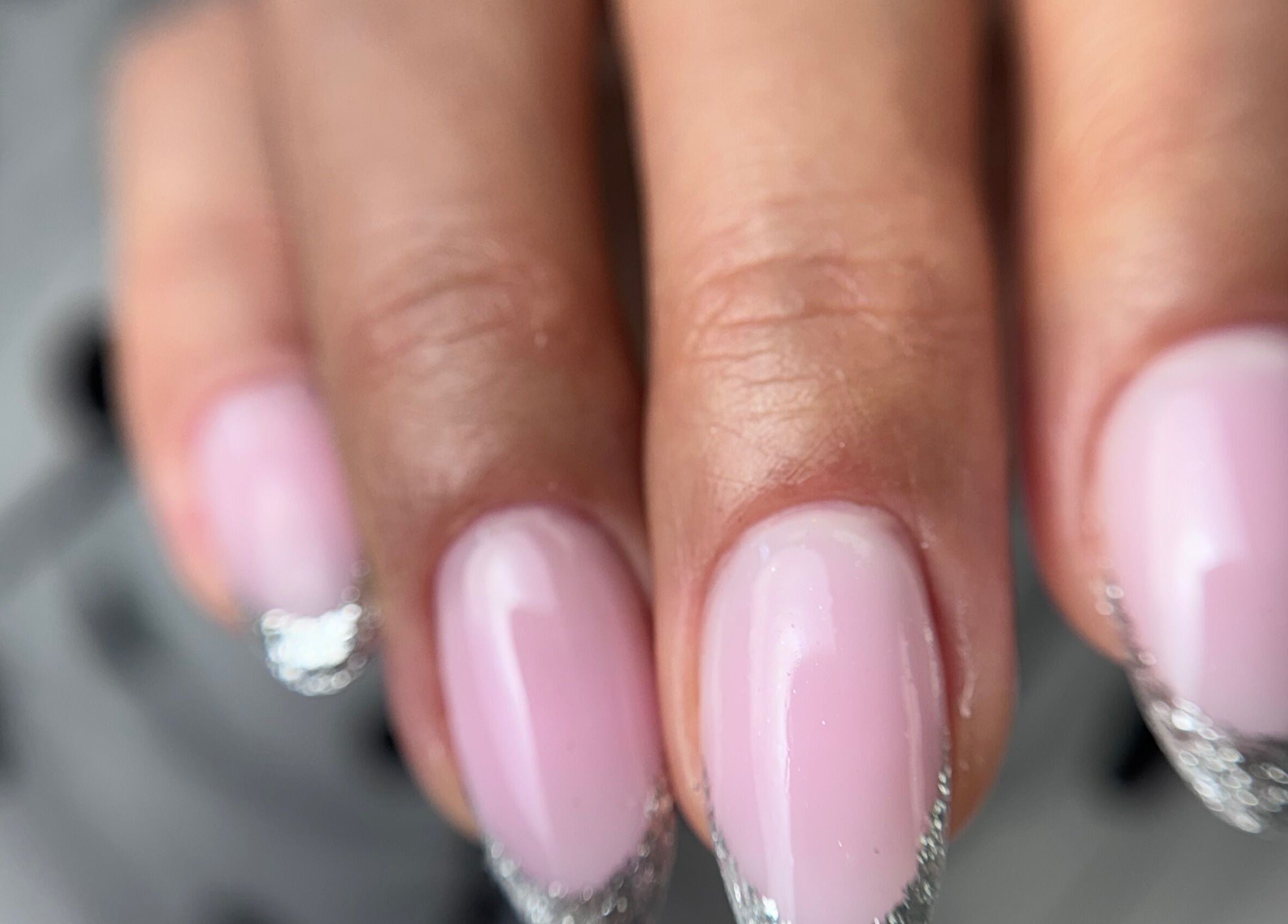 Pink nails with silver tips at Afina Beauty Studio, New York, New York, US.
