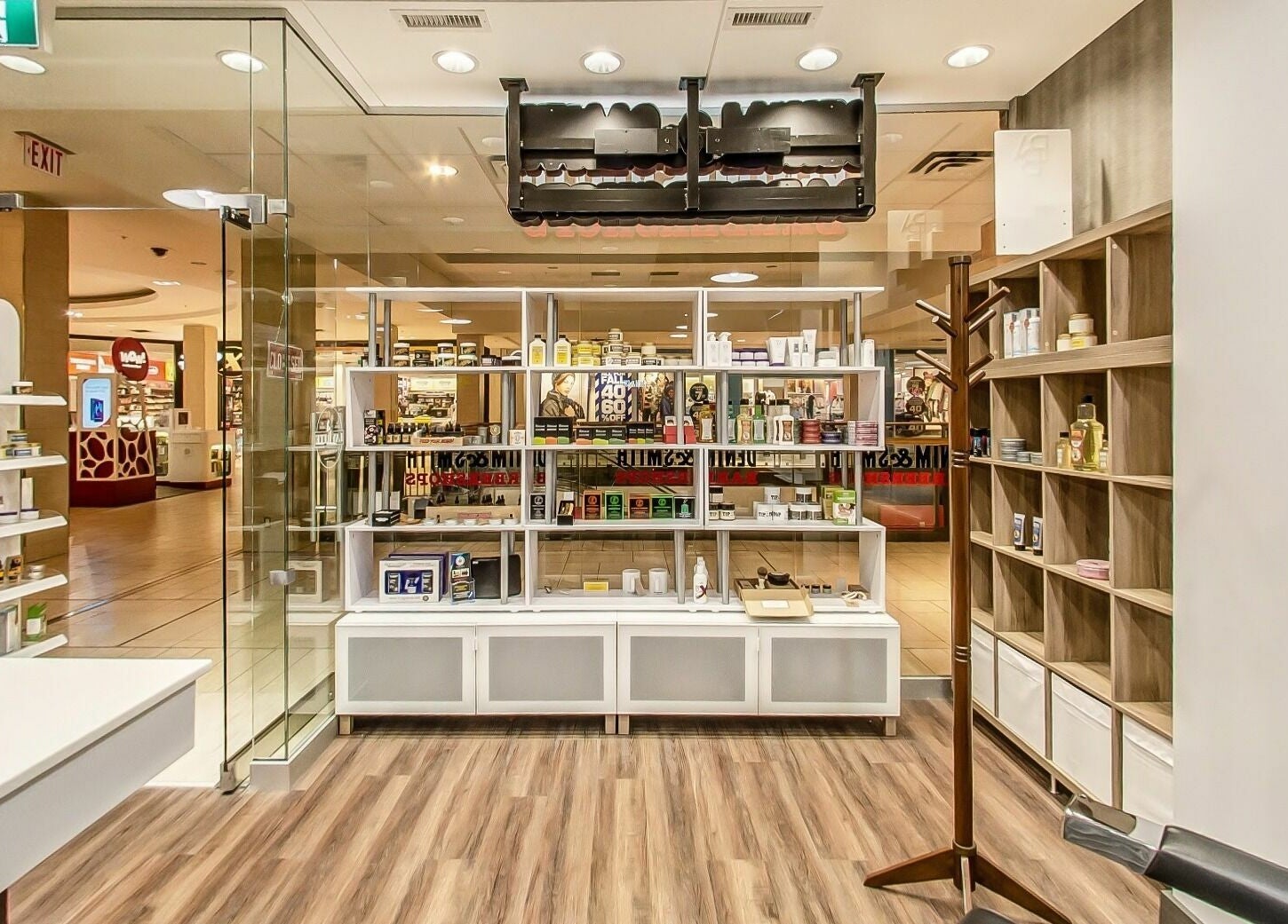 Spacious interior of Denim and Smith Barbershop Chinook, showcasing products in Calgary, Alberta, CA.