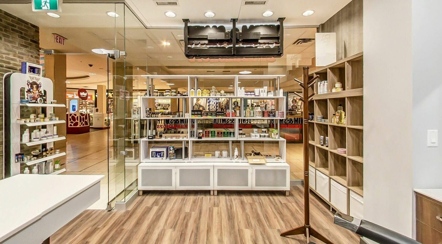 Spacious interior of Denim and Smith Barbershop Chinook, showcasing products in Calgary, Alberta, CA.