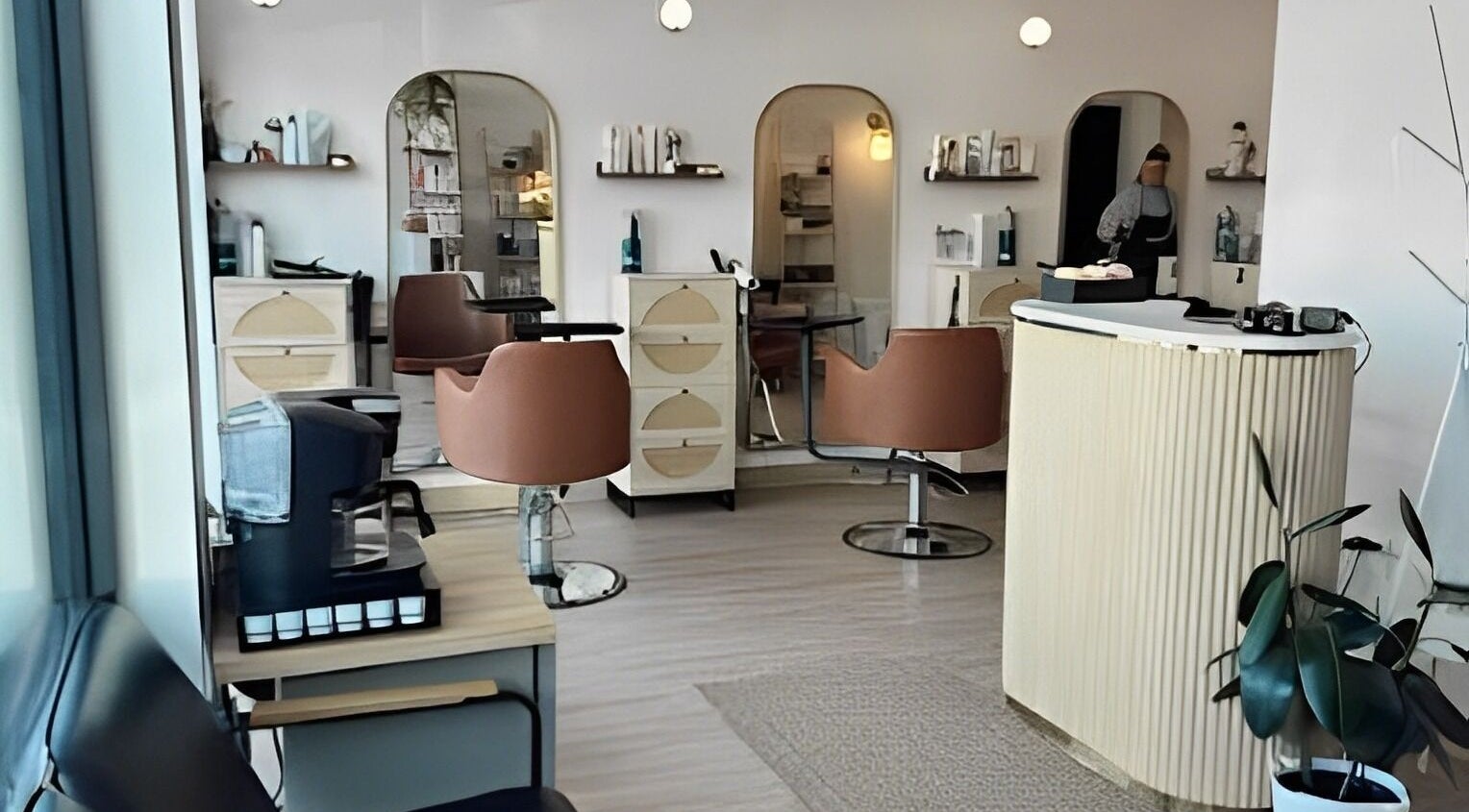 Interior of Blondie Hair Bar in Winnipeg, Manitoba, CA, showcasing modern decor and hairstyling stations.
