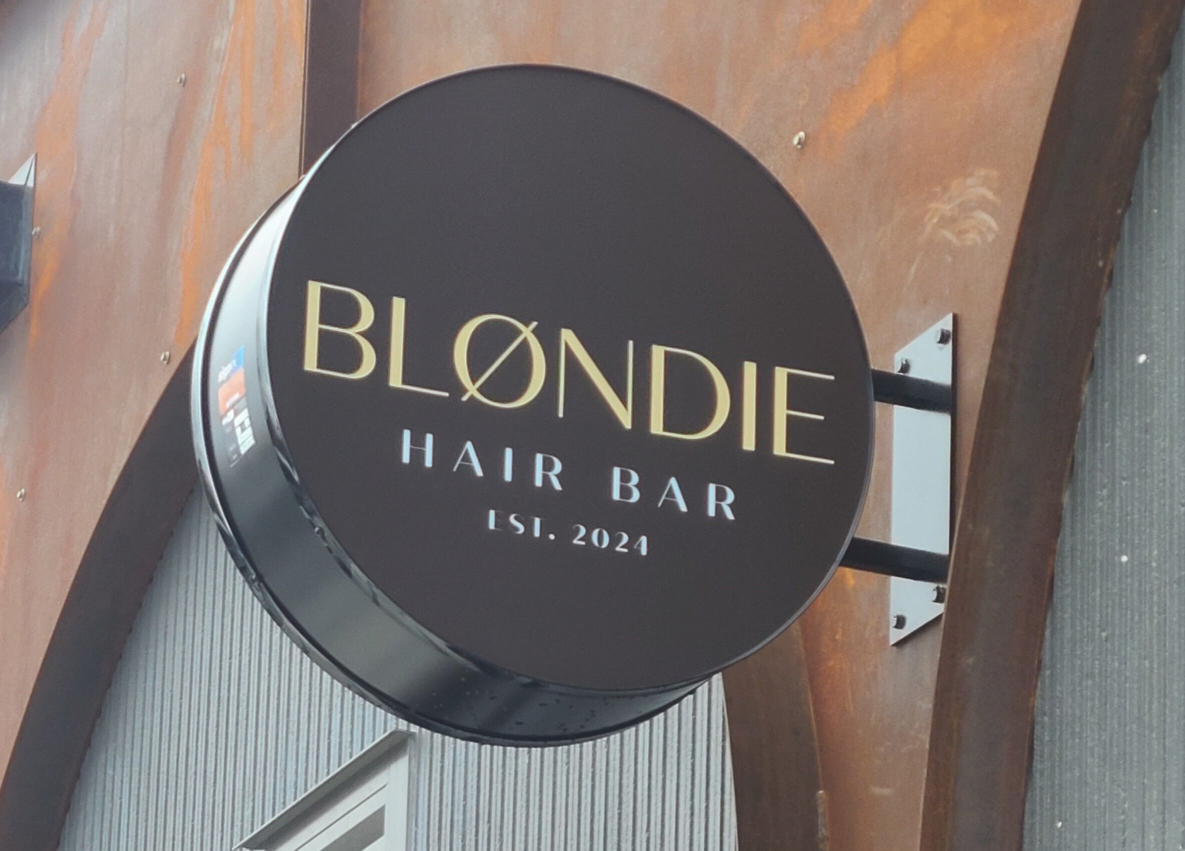 Modern sign of Blondie Hair Bar in Winnipeg, Manitoba, CA, showcasing sleek design and elegance.