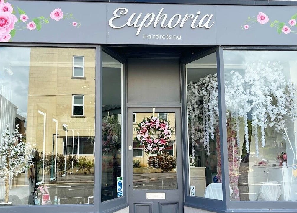 Euphoria Hairdressing entrance adorned with floral decor in Bath, England, GB.