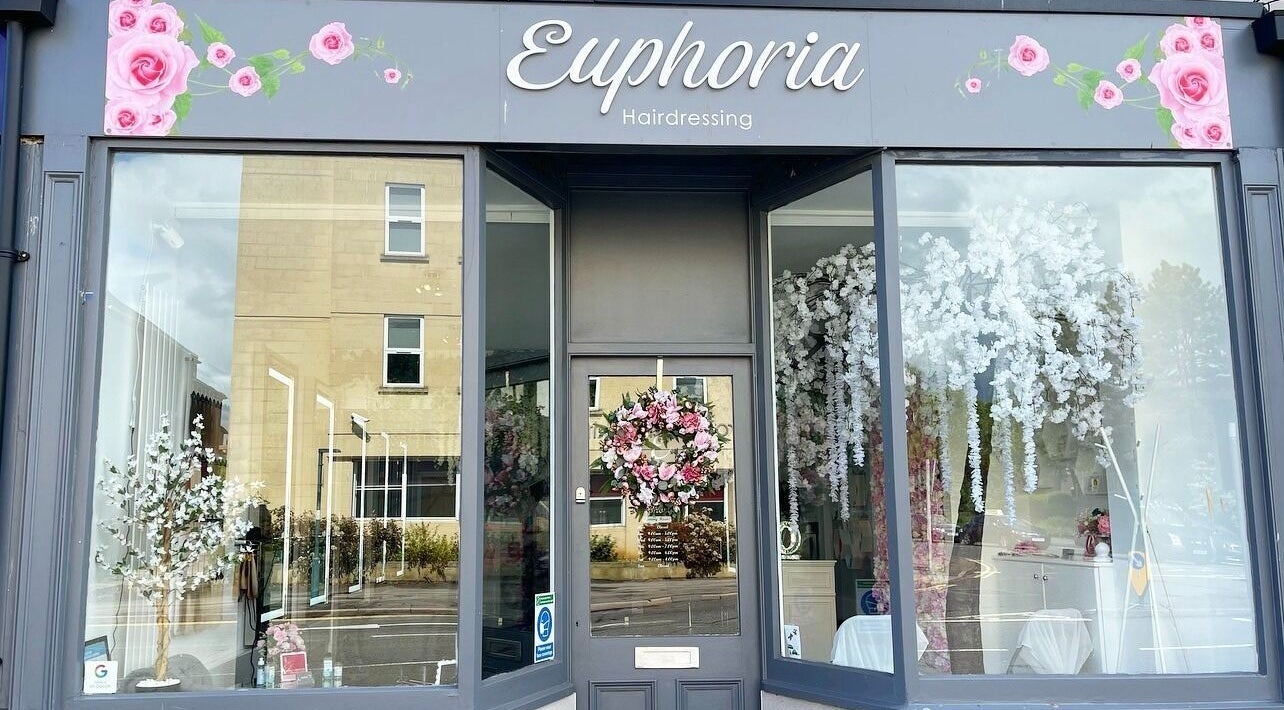 Euphoria Hairdressing entrance adorned with floral decor in Bath, England, GB.