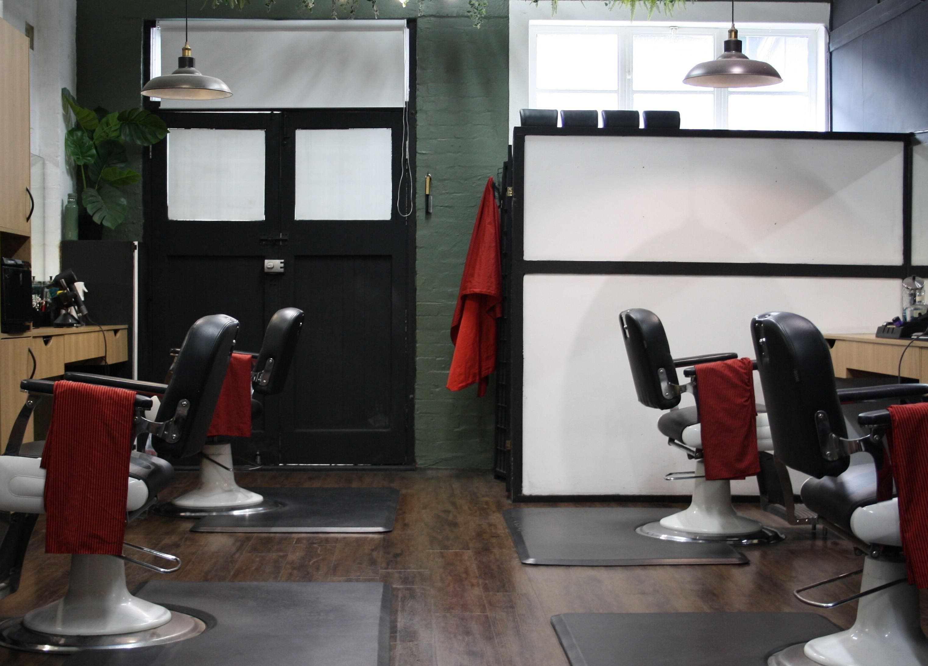 Barber chairs at The Barber Blueprint, Nundah, Queensland, AU. Modern and inviting setup.