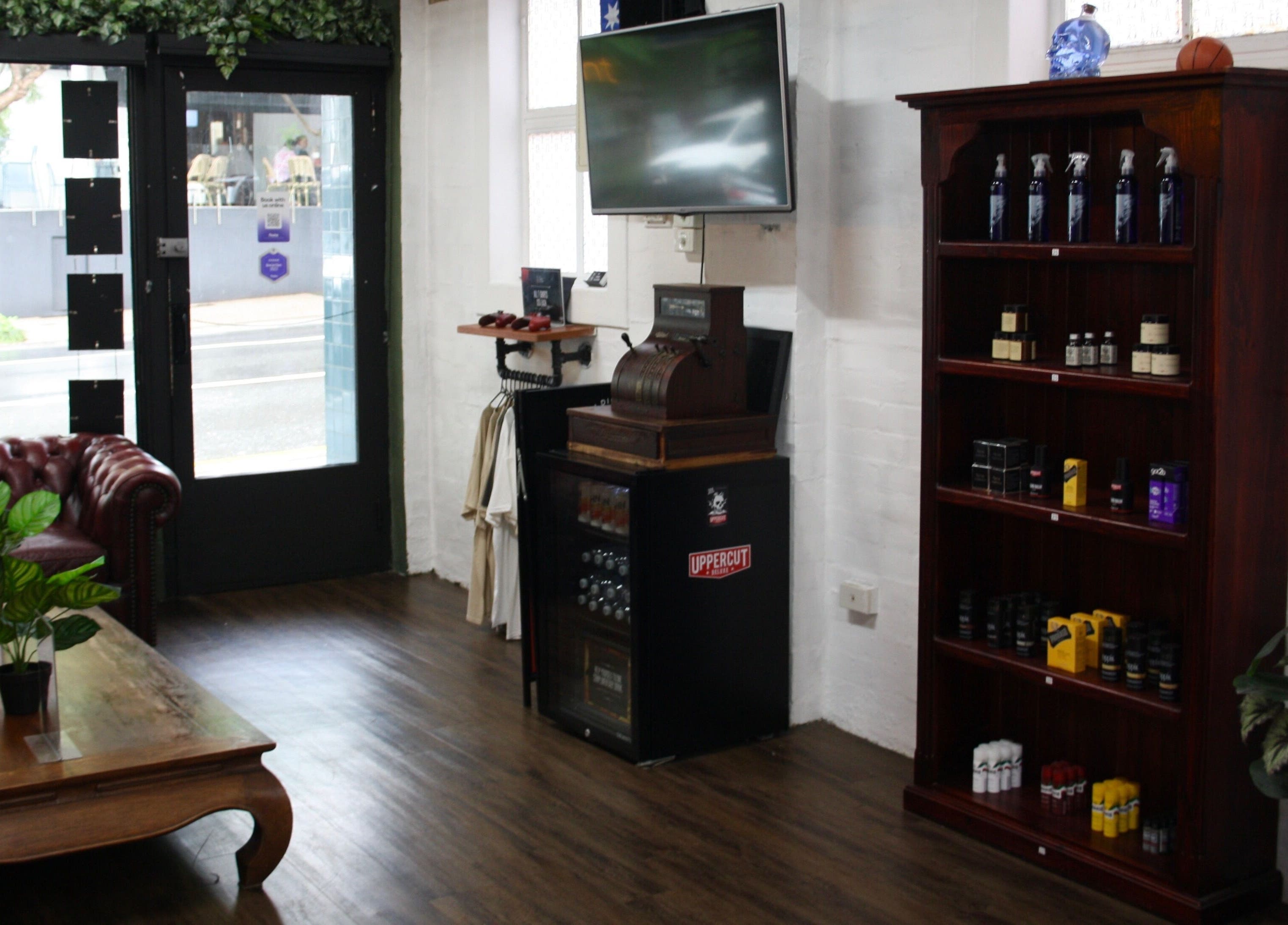 Elegant interior of The Barber Blueprint in Nundah, Queensland, AU with vintage decor and product shelves.