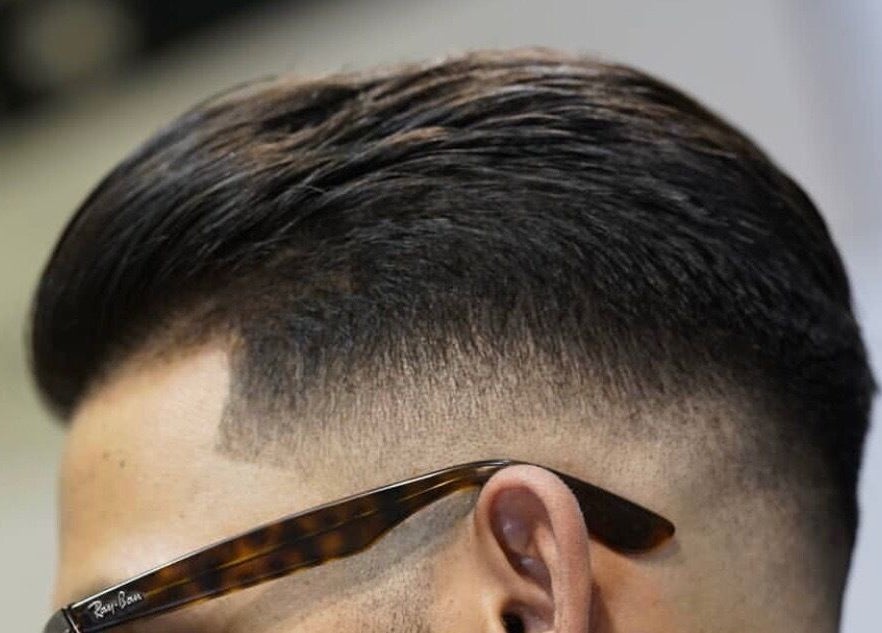 Stylish fade haircut at The Barber Blueprint in Nundah, Queensland, AU showcasing expert grooming.