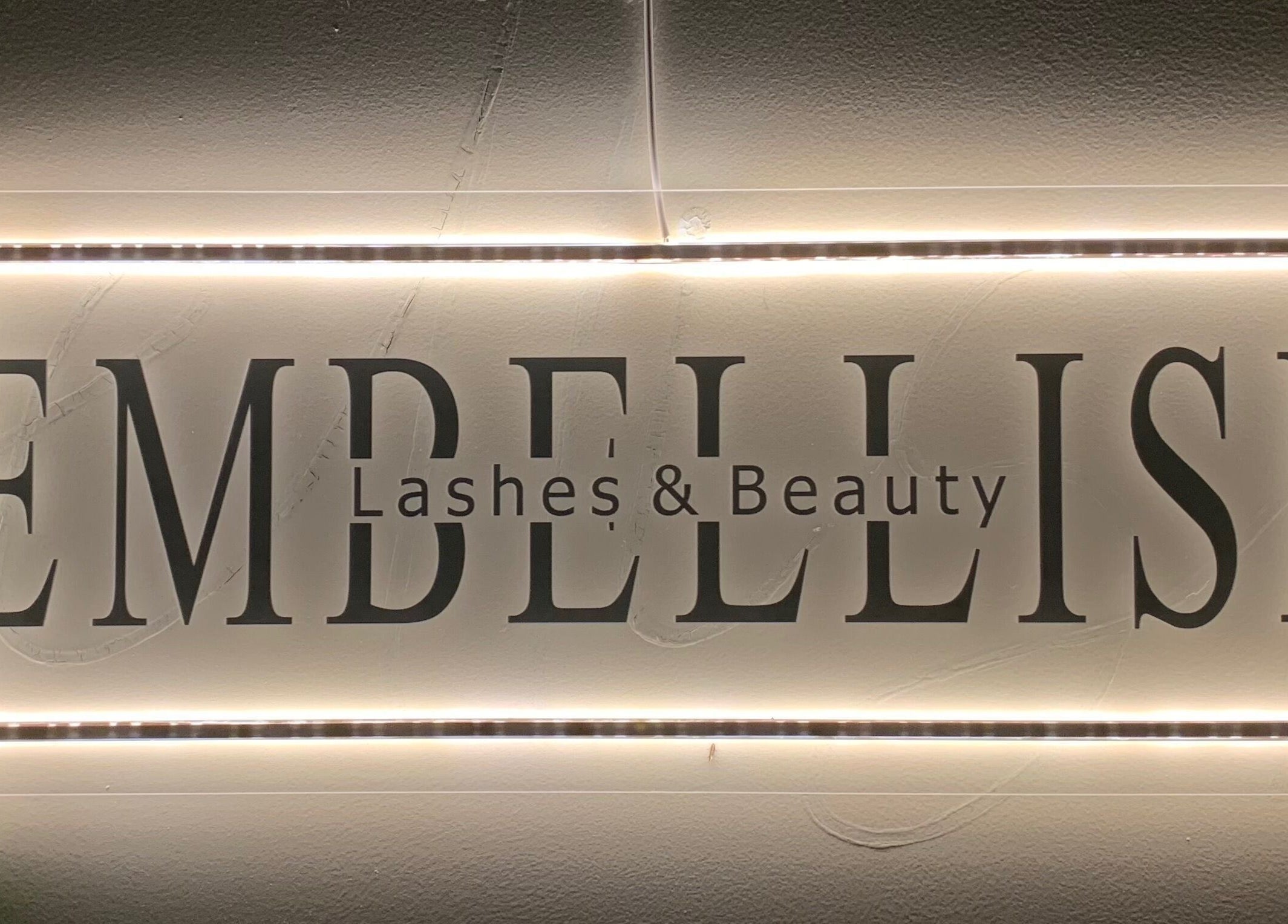 Illuminated Embellish Lashes & Beauty sign at Portland, Victoria, AU entrance.