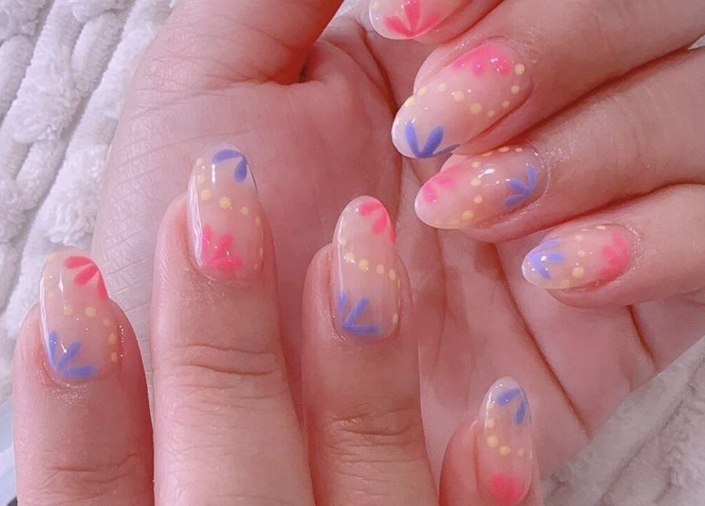Colorful dot and line nail art at MiuMiu Beauty Nails And Eyelashes, Toronto, Ontario, CA.
