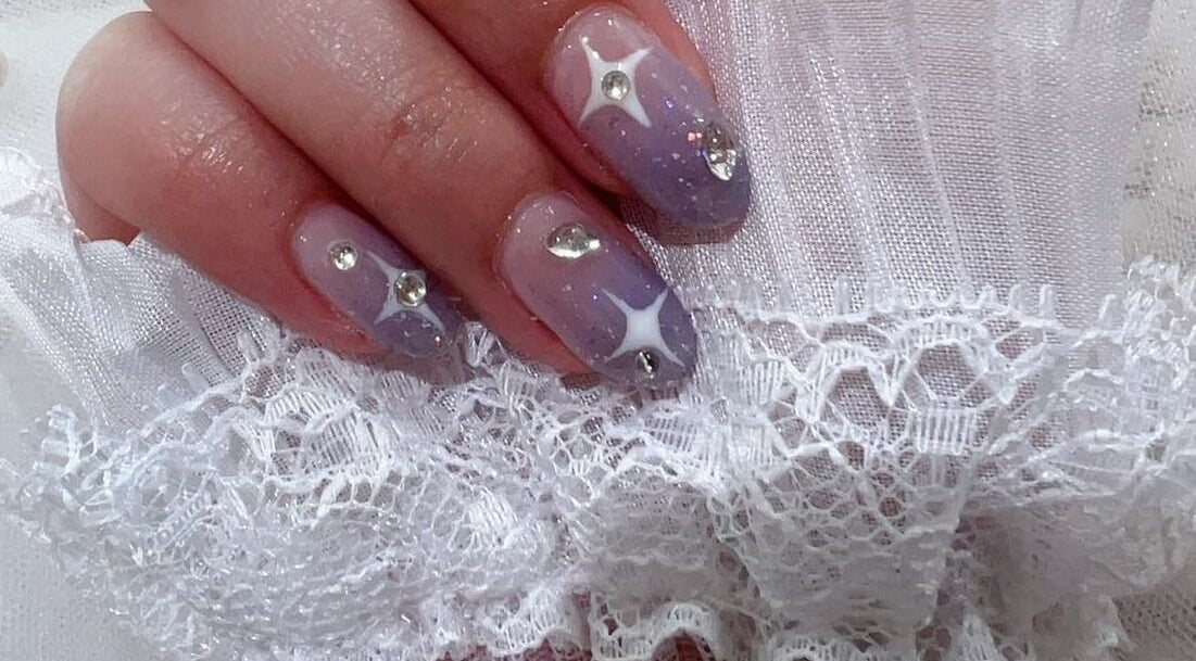 Sparkle nail design at MiuMiu Beauty Nails And Eyelashes in Toronto, Ontario, CA, featuring gems and lace.