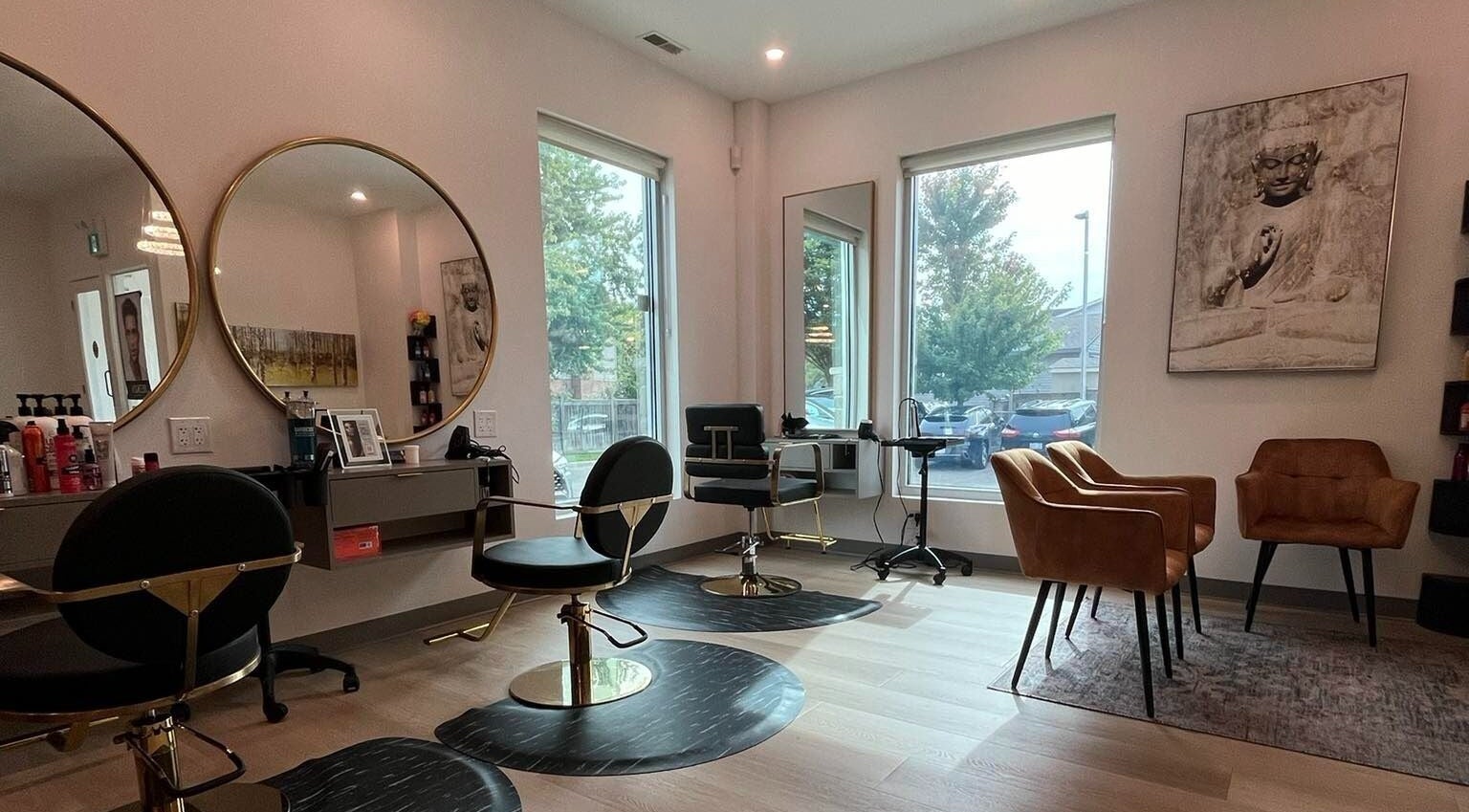 Modern interior of Sheer Elegance Salon in London, Ontario, CA with stylish chairs and decor.
