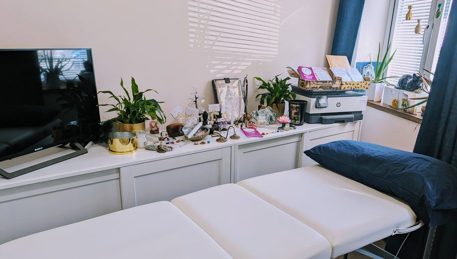 Elegant therapy room at The House on the Corner, Southend-on-sea, England, with cozy decor and soothing plants.