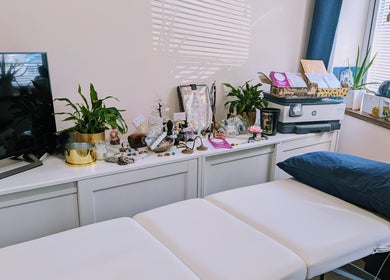 Elegant therapy room at The House on the Corner, Southend-on-sea, England, with cozy decor and soothing plants.