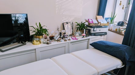 Elegant therapy room at The House on the Corner, Southend-on-sea, England, with cozy decor and soothing plants.