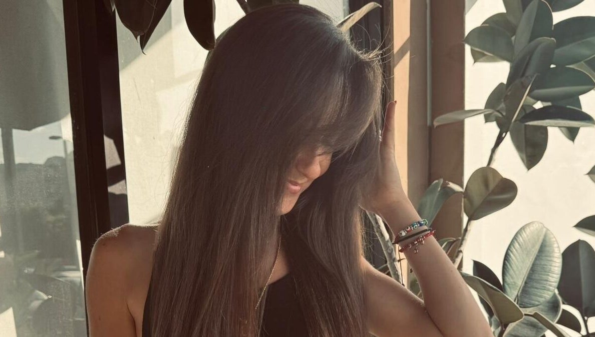 Customer enjoying stylish long hair at Planet Stella hair salon in North Miami Beach, Florida, US.