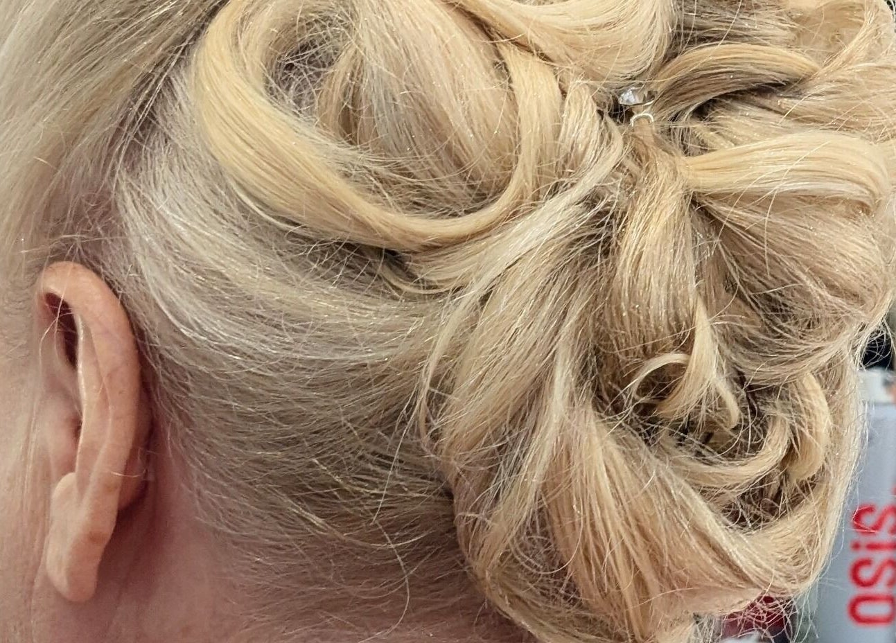 Elegant blonde updo styling at Planet Stella hair salon, North Miami Beach, Florida, US.