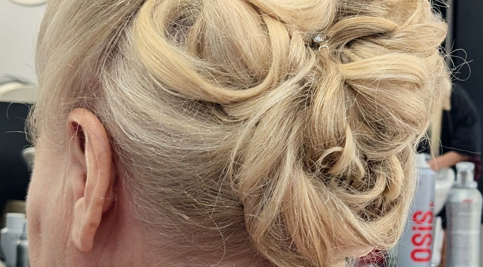 Elegant blonde updo styling at Planet Stella hair salon, North Miami Beach, Florida, US.