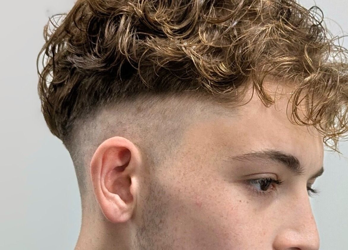 Curly fade haircut at Planet Stella hair salon, North Miami Beach, Florida, US.