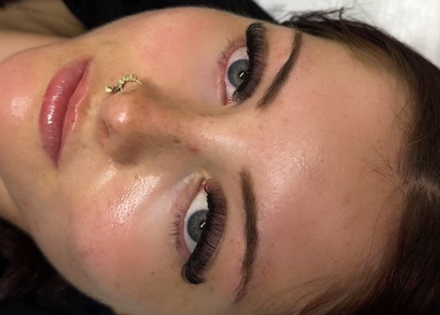 A woman with expertly done eyelashes at Lashes by Eden, Brighton And Hove, England, GB.