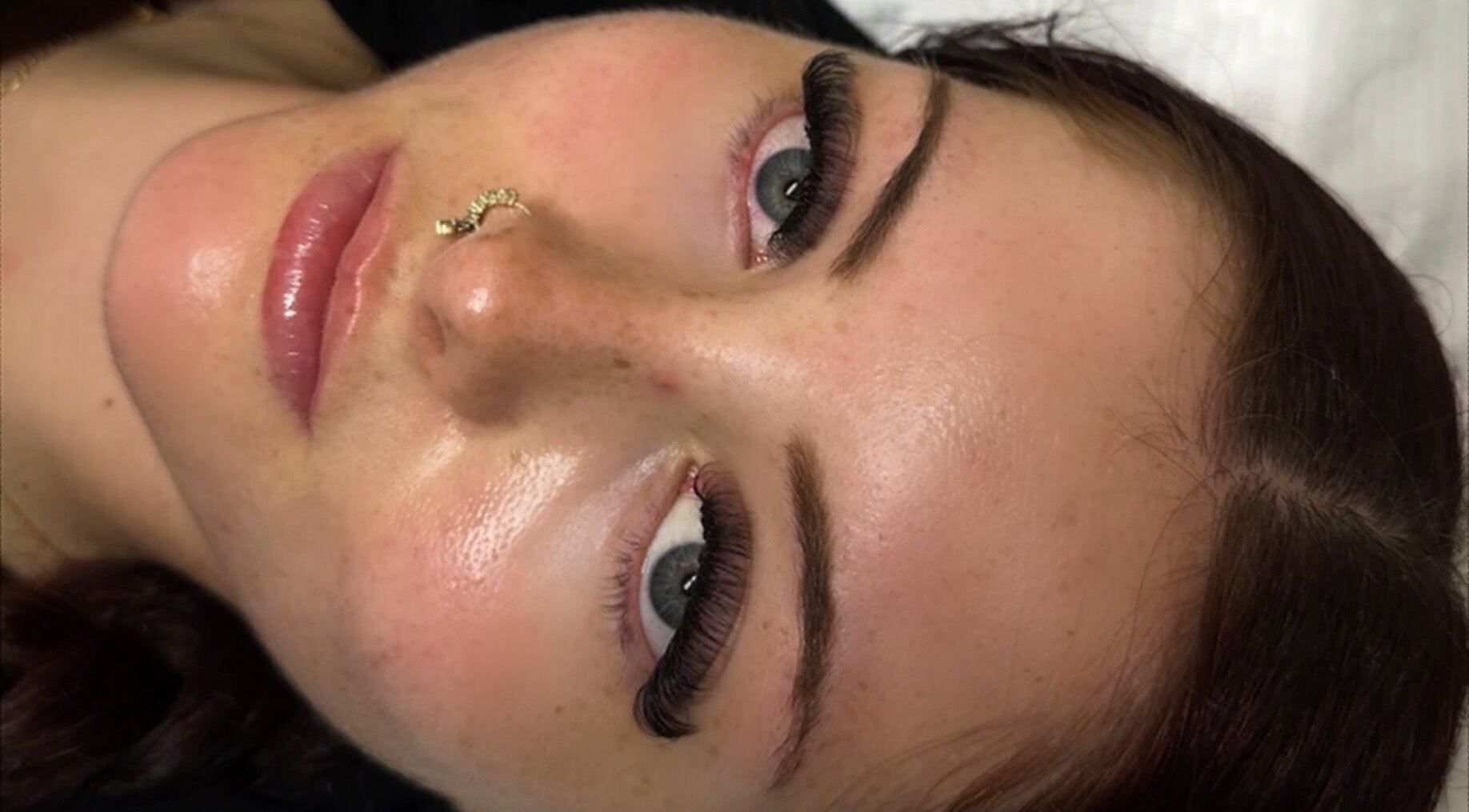 A woman with expertly done eyelashes at Lashes by Eden, Brighton And Hove, England, GB.