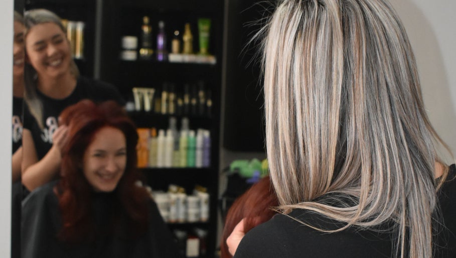 Stylists at Rejuven8 on Dexter Salon in Cape Town crafting vibrant looks for clients in Western Cape, ZA.