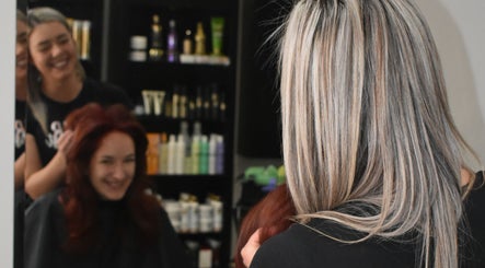 Stylists at Rejuven8 on Dexter Salon in Cape Town crafting vibrant looks for clients in Western Cape, ZA.