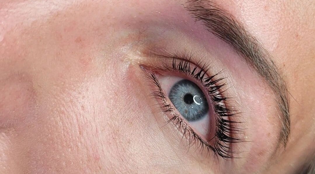 Highlighted blue eye with elegant lashes at Bootique Beauty in Brisbane, Queensland, AU.