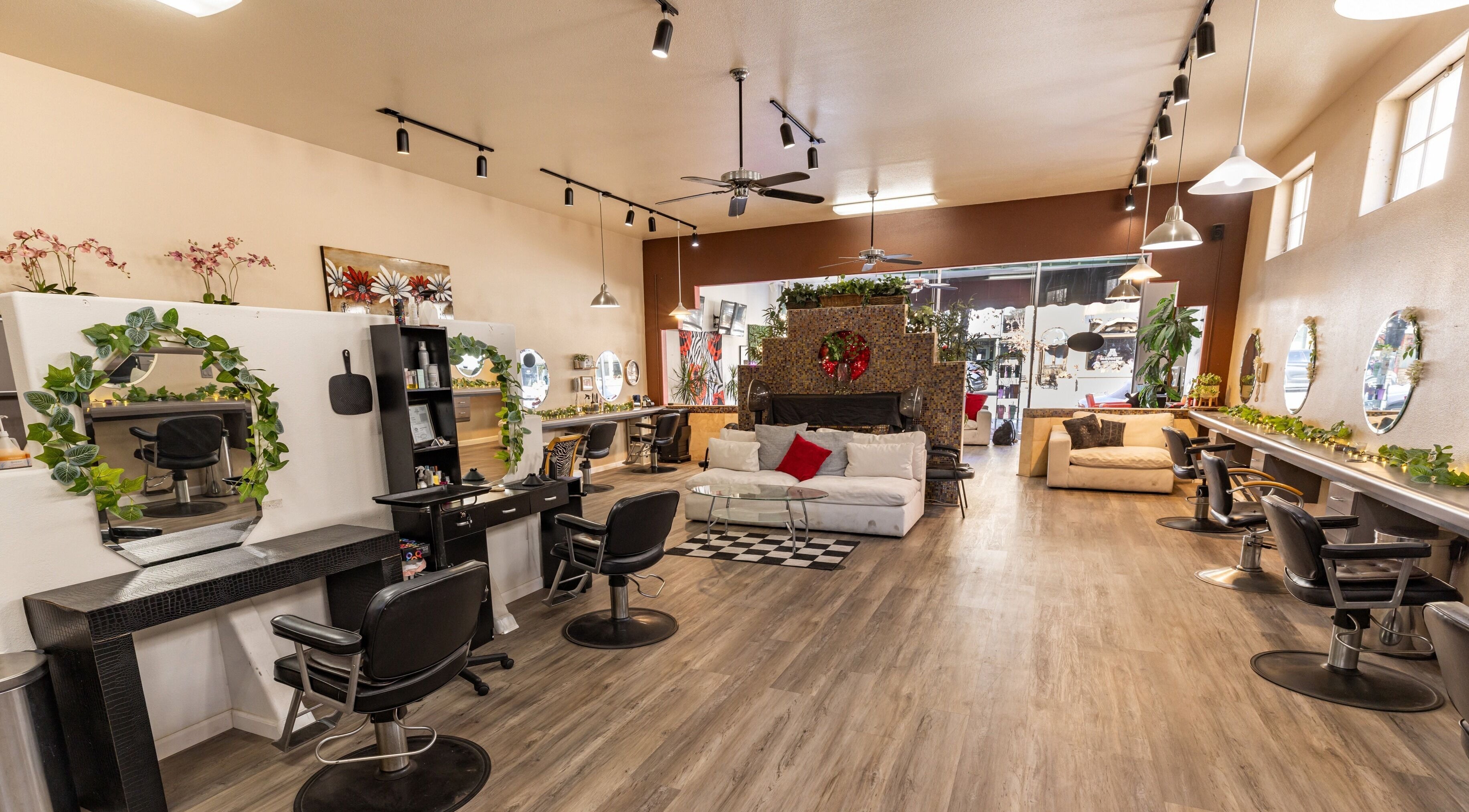 Modern salon interior at Beauty and the Barber in Arroyo Grande, California, US, showcasing chic styling stations.