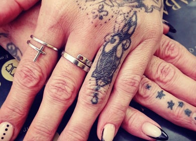 Beautiful nail art over tattooed hands at Saba Beauty Emporium in Pretoria, Gauteng, ZA.