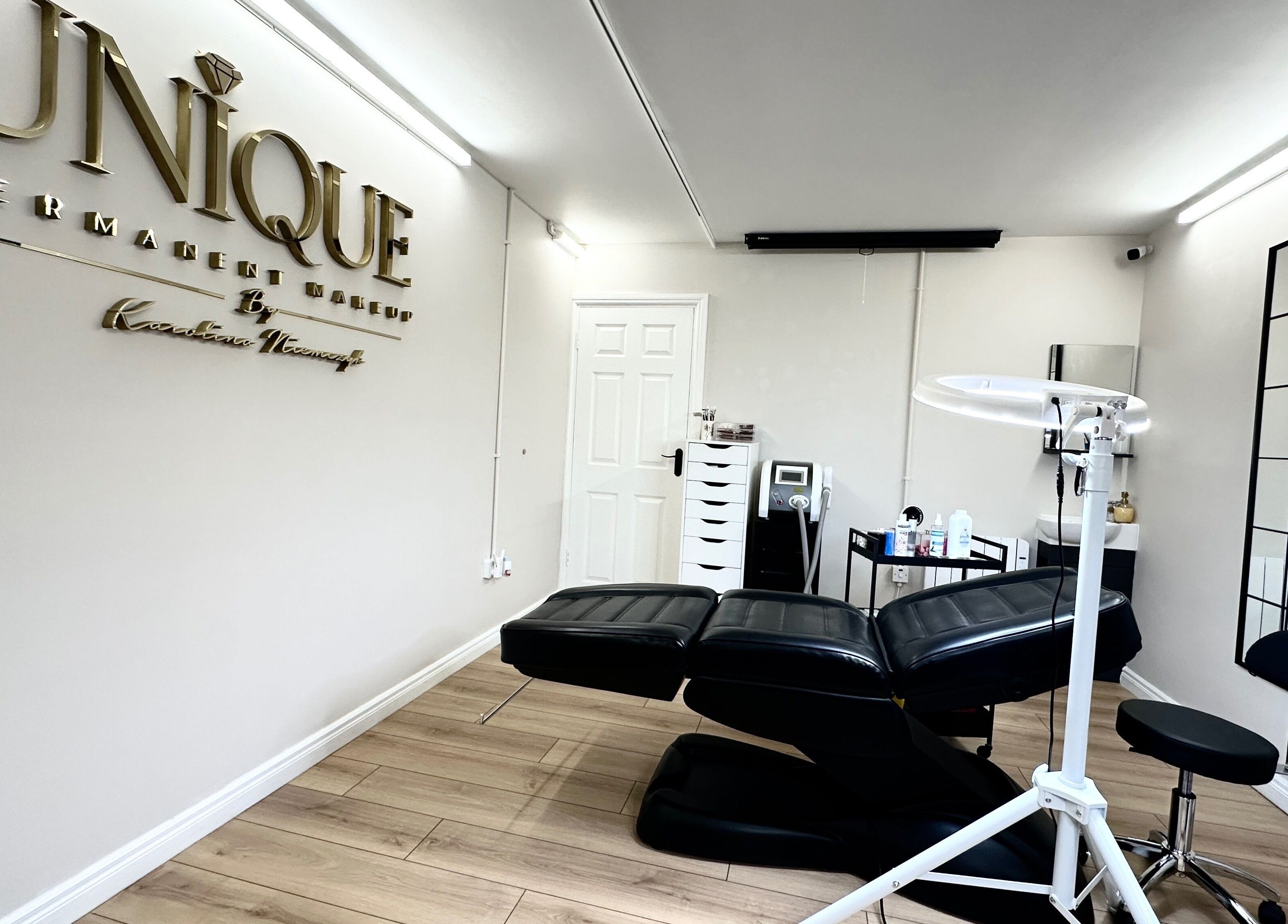 Modern treatment room at Unique Permanent Makeup in Tralee, County Kerry, IE featuring comfortable seating.