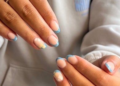 Elegant blue-tipped nails at The Biab Room, Cwmparc, Wales, GB. Perfect for enhancing beauty and style.