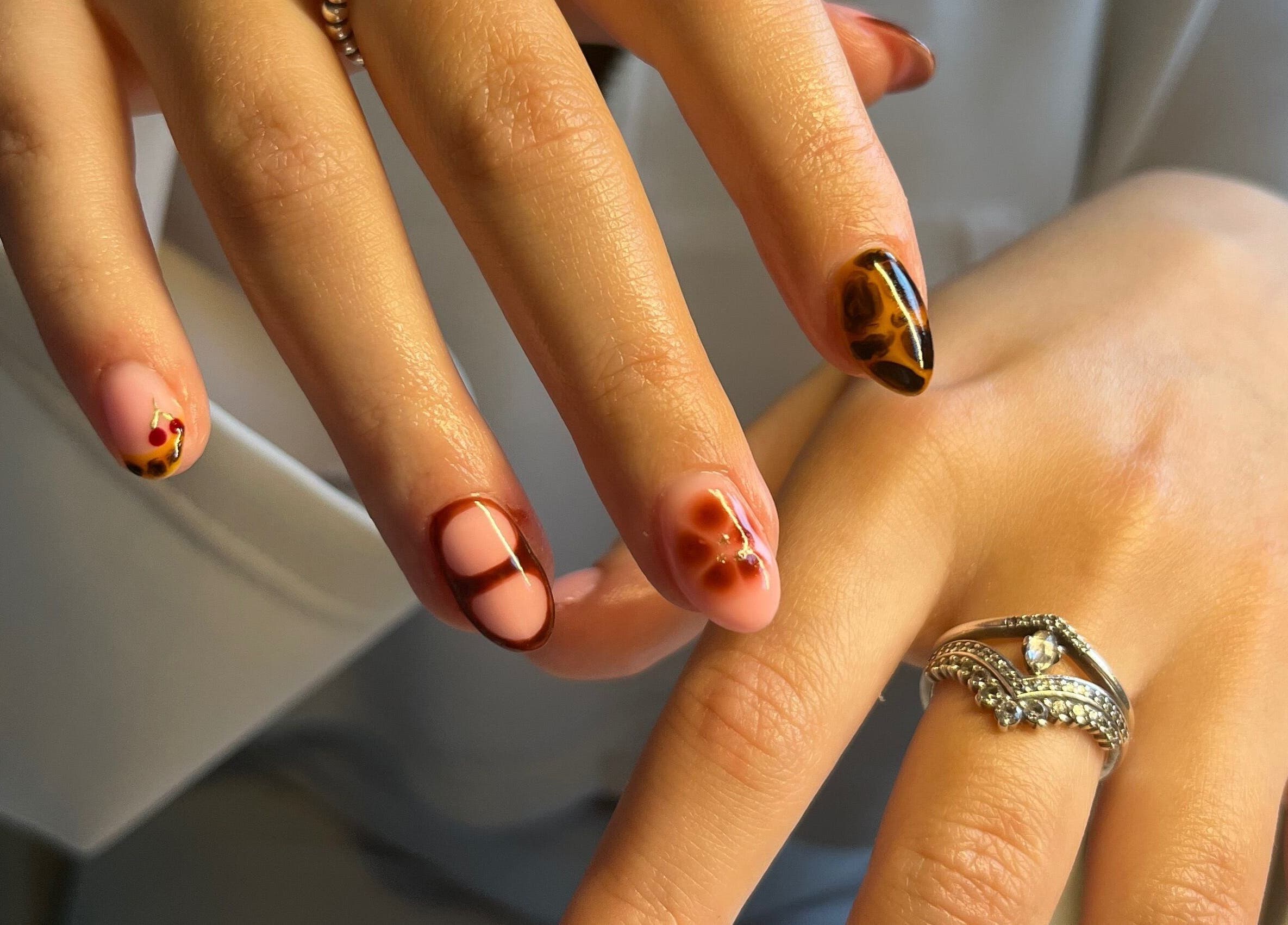 Elegant nail art with intricate designs at The Biab Room, Cwmparc, Wales, GB.