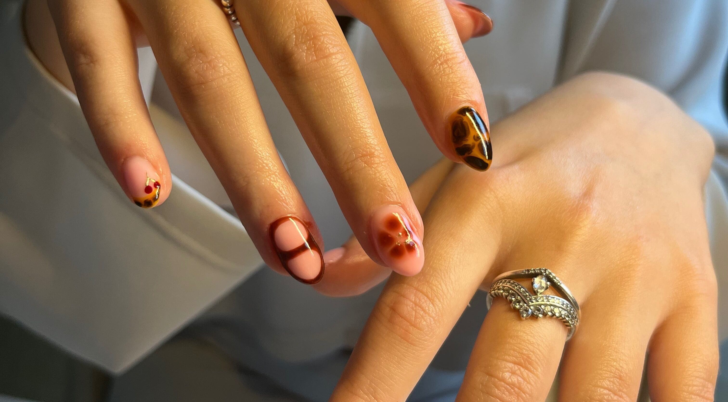 Elegant nail art with intricate designs at The Biab Room, Cwmparc, Wales, GB.