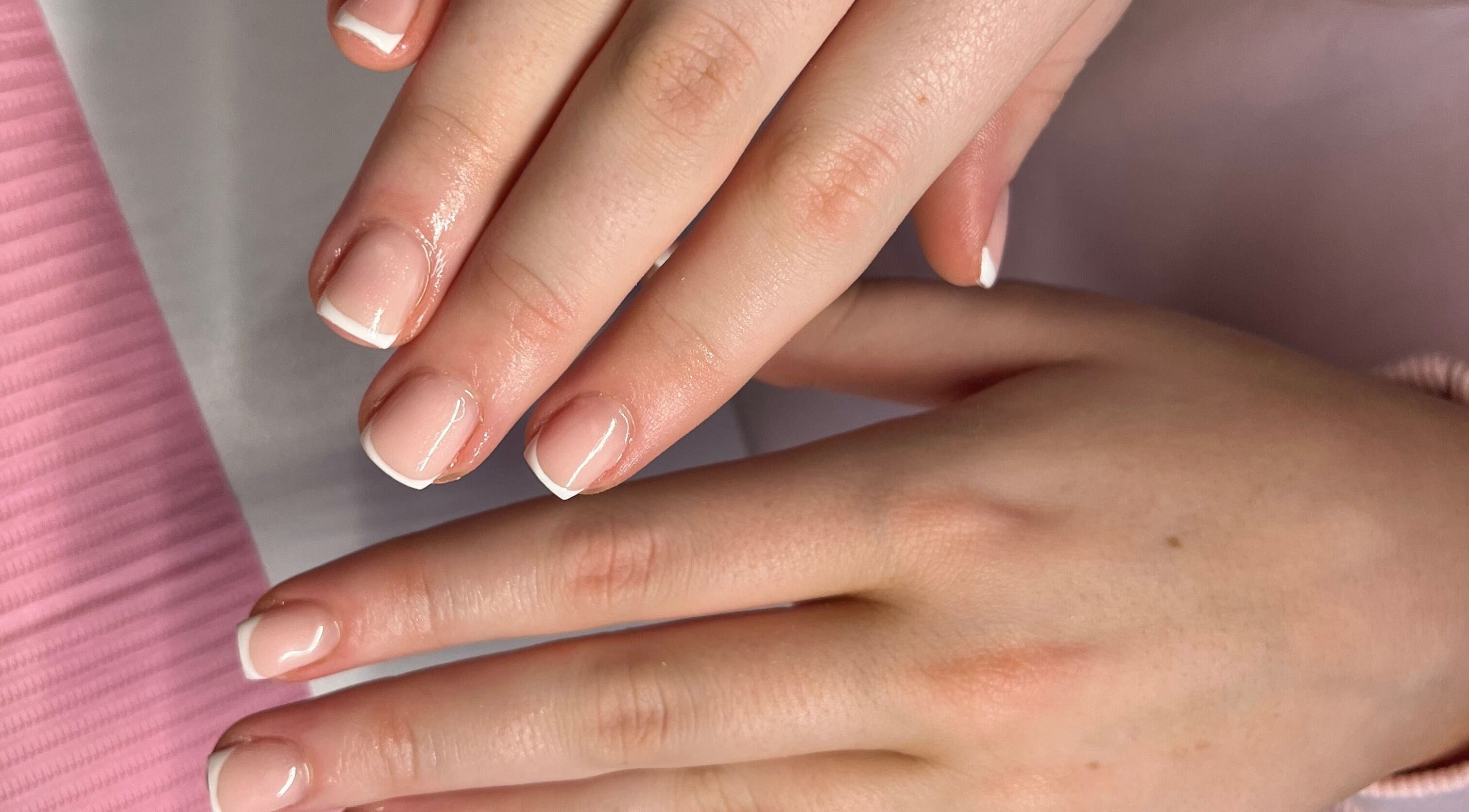 Smooth French manicure at The Biab Room, Cwmparc, Wales, GB, showcasing expert nail care.