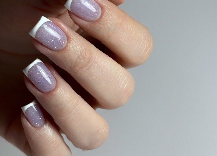 French manicured nails at Zhekova Nails Academy, Epsom, England, GB. Glossy and stylish design.