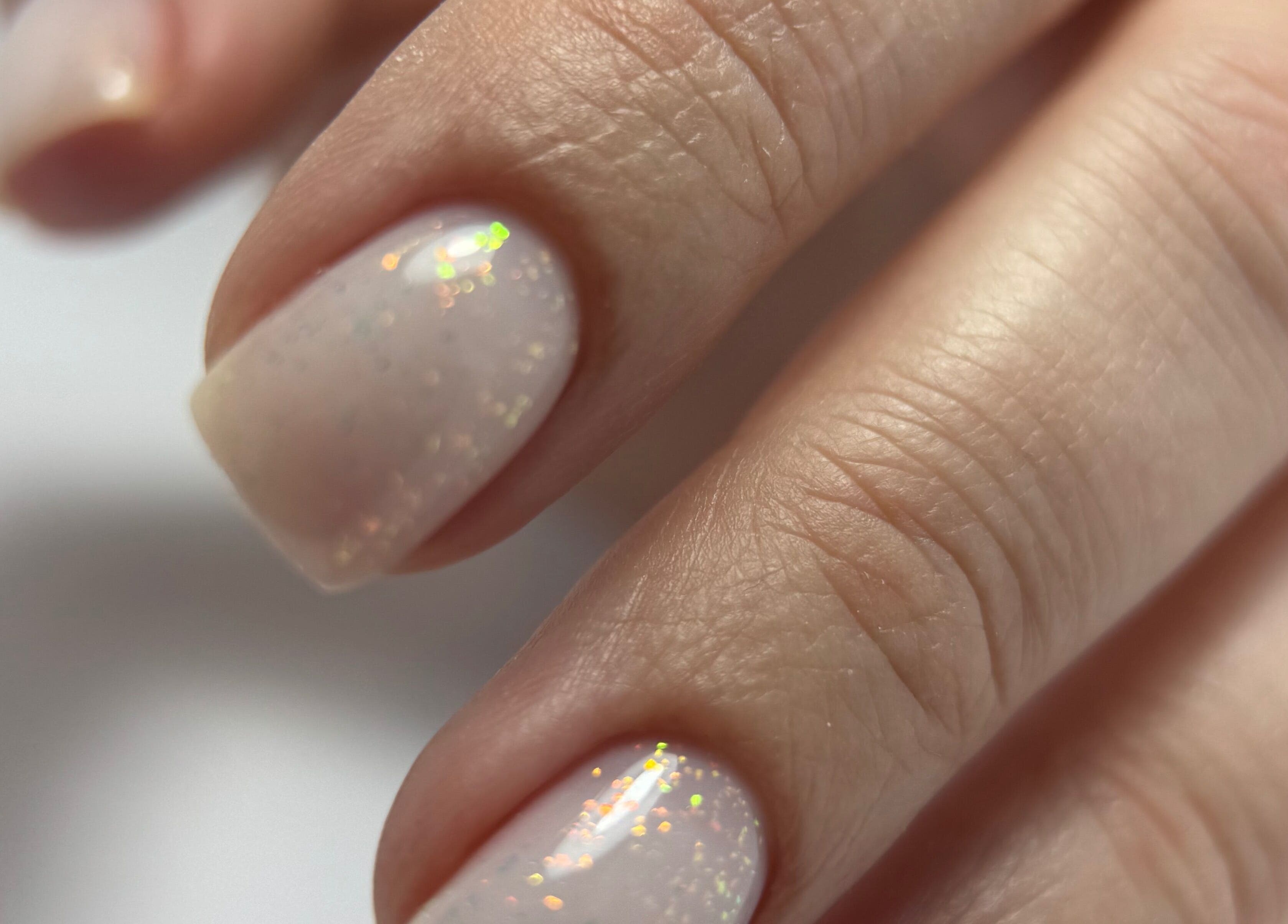 Sparkling manicure at Zhekova Nails Academy, Epsom, England, GB showcases elegant nail art.