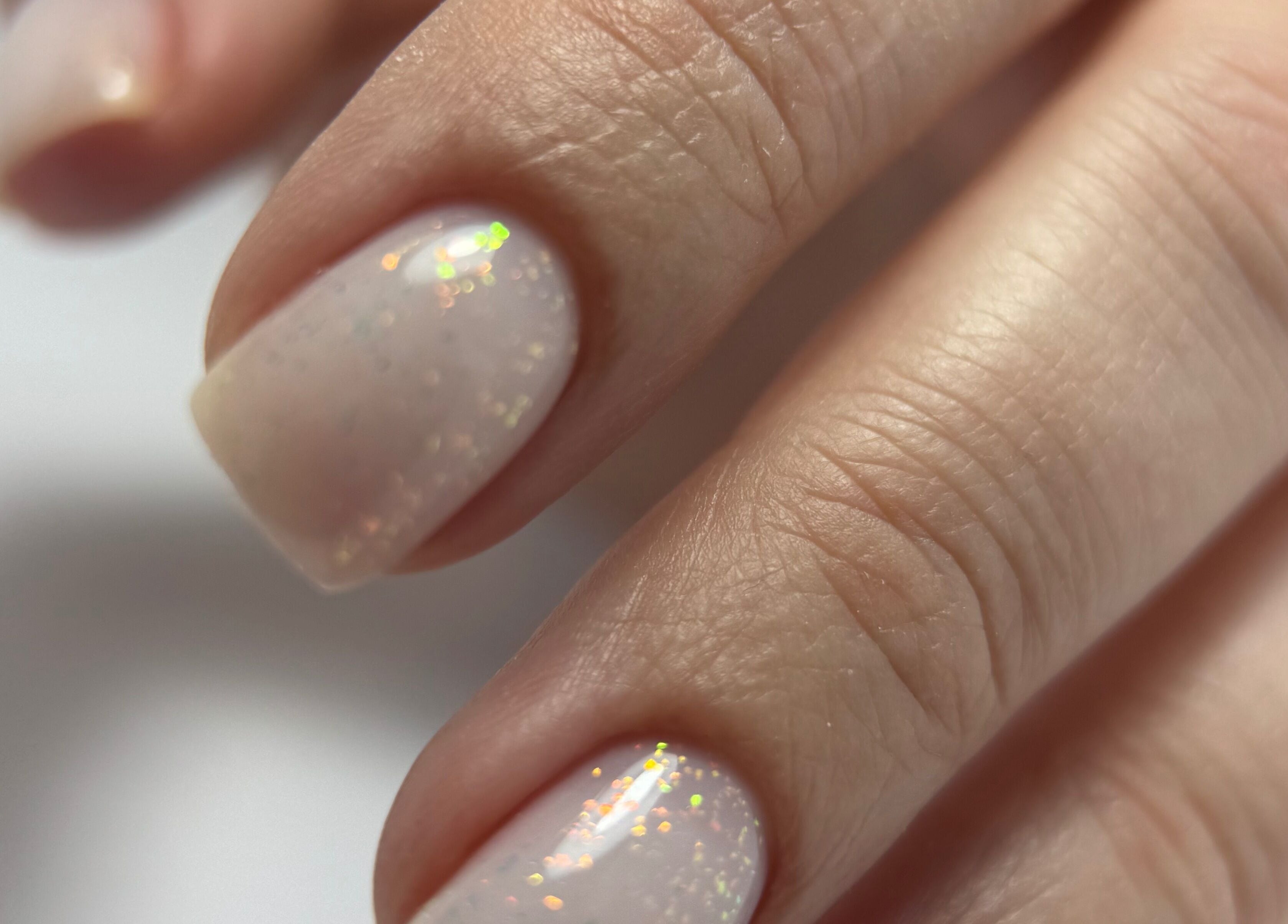 Sparkling manicure at Zhekova Nails Academy, Epsom, England, GB showcases elegant nail art.