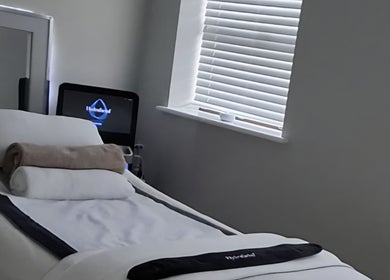 Relaxing spa room at Silk Powder Limited, Leicestershire, GB, featuring a cozy treatment bed.