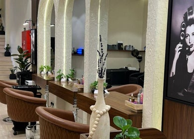 Lavandula Salon's elegant interior in Riyadh, Riyadh Province, SA features vintage decor and cozy styling chairs.
