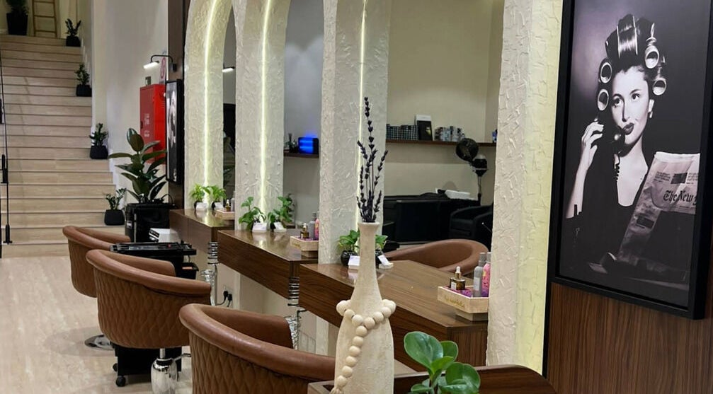 Lavandula Salon's elegant interior in Riyadh, Riyadh Province, SA features vintage decor and cozy styling chairs.