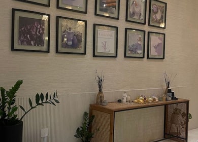 Elegant decor at Lavandula Salon, Riyadh with framed art and plants enhancing a serene atmosphere.