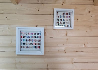 Framed nail art displays at Shells Nailz, Chelmsford, England, GB highlighting creative designs.