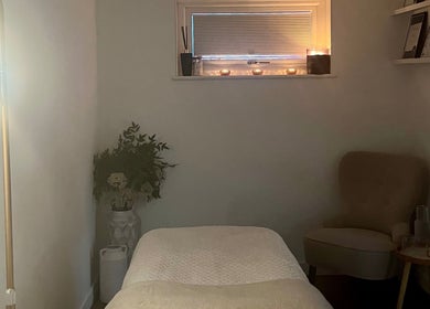 Serene therapy room at Brows & Beauty by Georgia, Effingham, England, GB, with cozy seating and soothing decor.