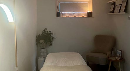 Serene therapy room at Brows & Beauty by Georgia, Effingham, England, GB, with cozy seating and soothing decor.