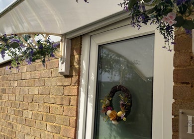 Festive door with floral decor at Brows & Beauty by Georgia in Effingham, England, GB.