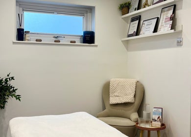 Cozy treatment room at Brows & Beauty by Georgia in Effingham, England, GB, featuring elegant decor and relaxing atmosphere.