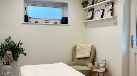 Cozy treatment room at Brows & Beauty by Georgia in Effingham, England, GB, featuring elegant decor and relaxing atmosphere.