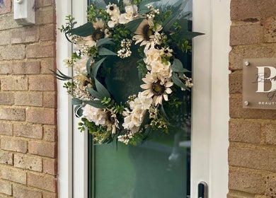 Elegant wreath on the door of Brows & Beauty by Georgia, Effingham, England, GB.